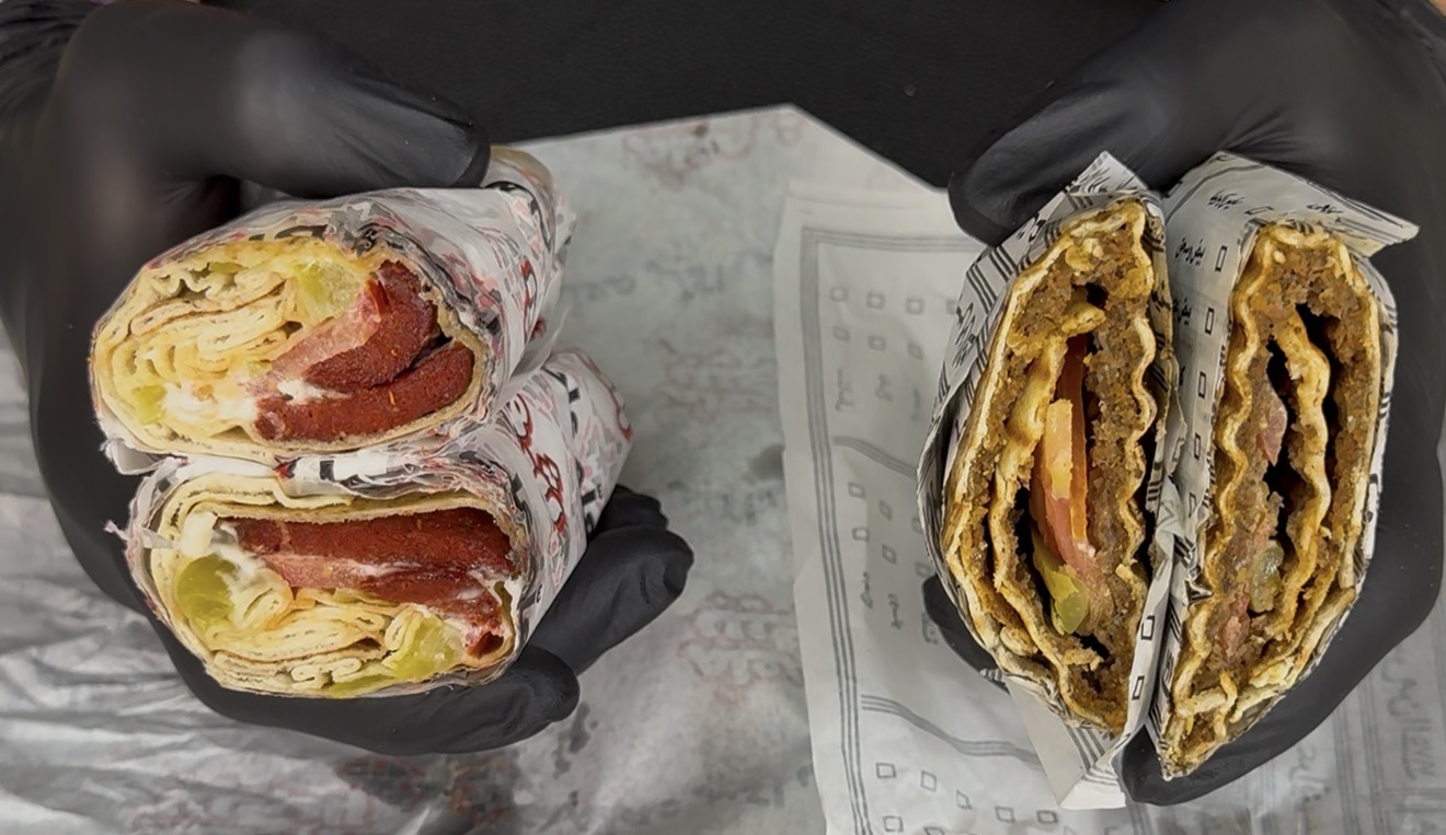 Soujouk sandwiches side by side — Maalem Chakib on the left, Hajj Nasr on the right